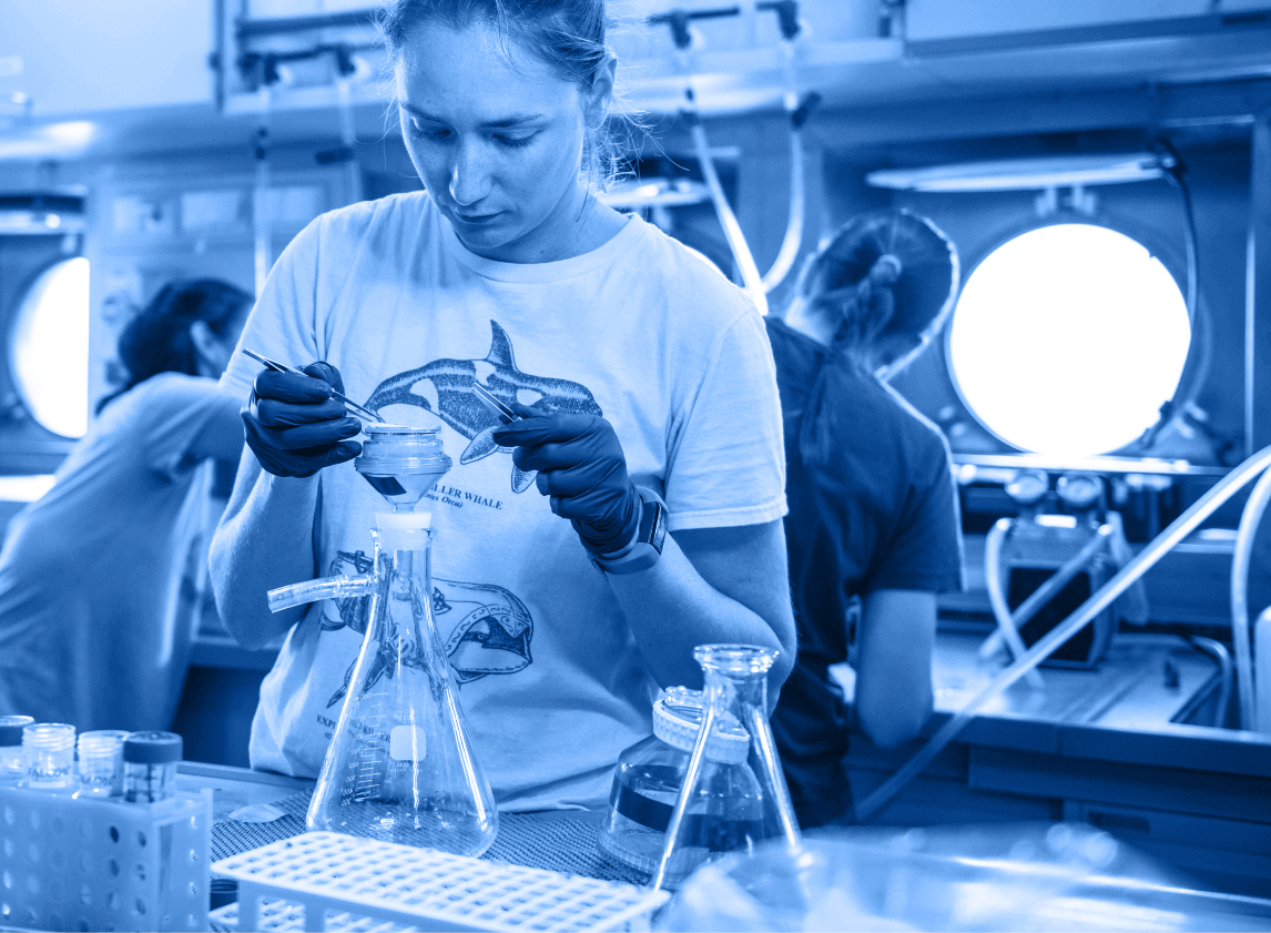 Scientist preserving samples collected with ROV SuBastian in the wet lab aboard Falkor.